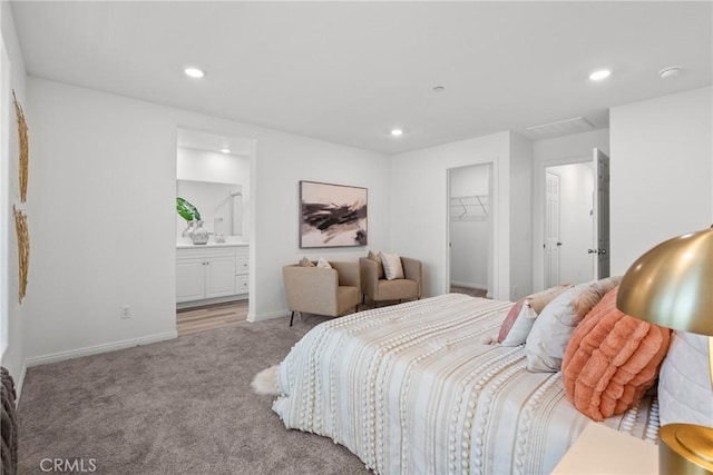 3981 E Huntington St, Ontario, CA 91761 - bedroom featuring a walk in closet, carpet floors, baseboards, and recessed lighting