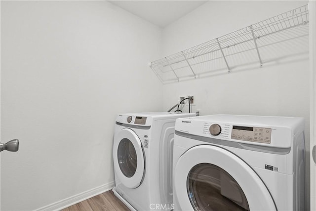3981 E Huntington St, Ontario, CA 91761 - laundry area featuring baseboards, laundry area, light wood-type flooring, and independent washer and dryer