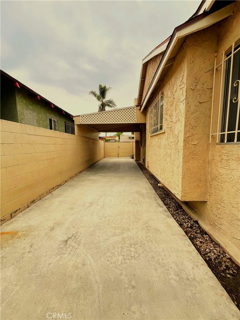 view of home's exterior featuring a fenced backyard, a patio area, and stucco siding