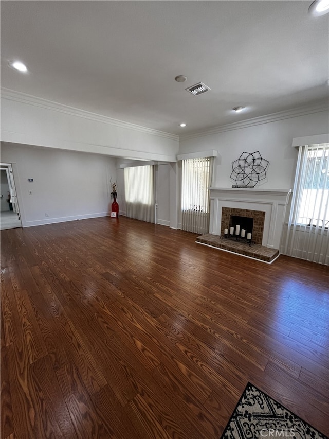 1449 W 45th St, Los Angeles, CA 90062 - unfurnished living room with a brick fireplace, wood finished floors, crown molding, baseboards, and recessed lighting