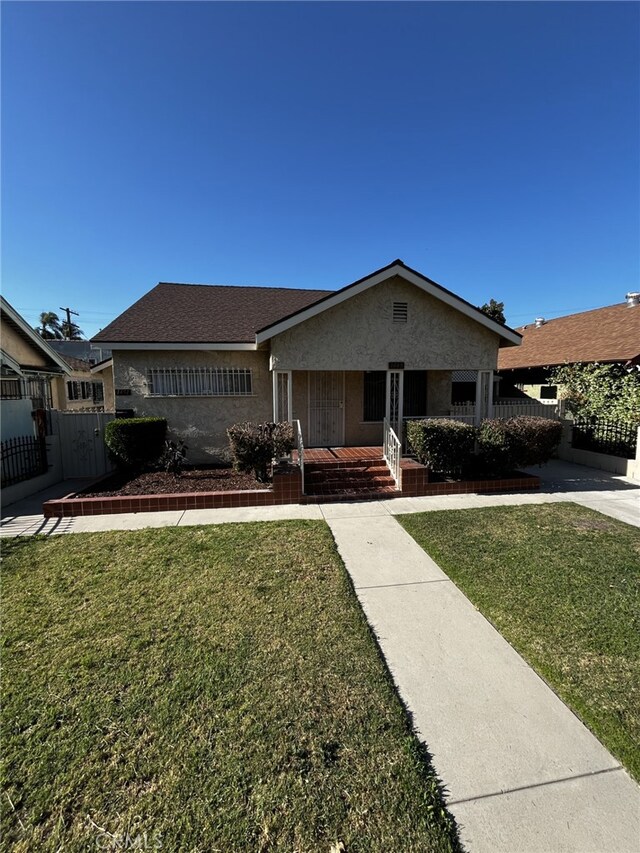 1449 W 45th St, Los Angeles, CA 90062 - ranch-style home featuring a porch and stucco siding