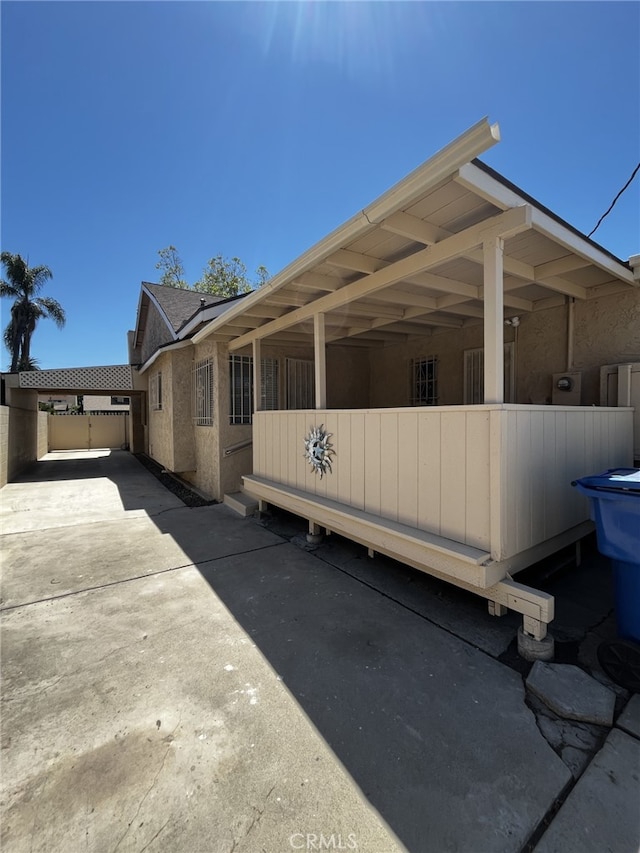 1449 W 45th St, Los Angeles, CA 90062 - view of side of property with fence and stucco siding