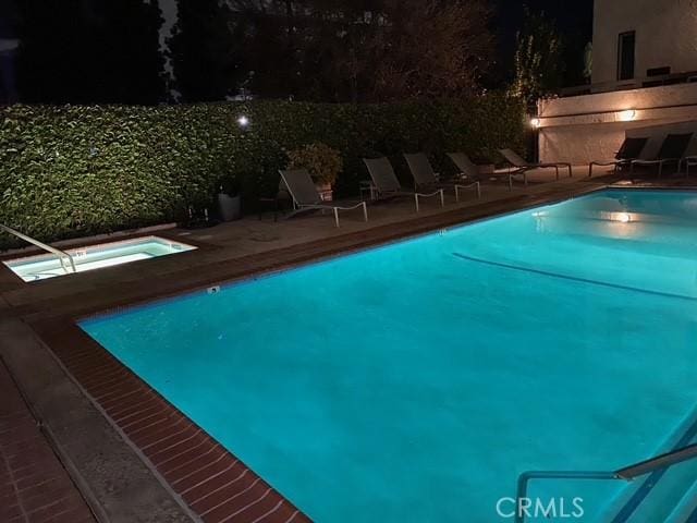 pool featuring a patio area and a community hot tub