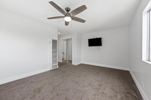 1990 Harrison Ave, San Diego, CA 92113 - unfurnished bedroom with a heating unit, carpet, baseboards, and a ceiling fan