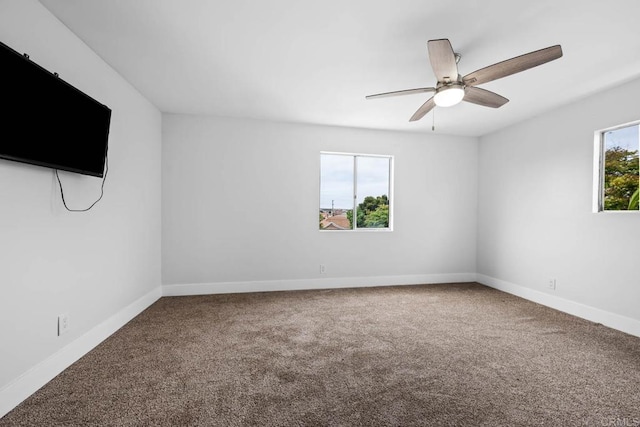 1990 Harrison Ave, San Diego, CA 92113 - carpeted empty room with a ceiling fan and baseboards