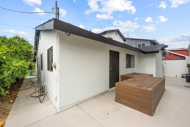 1990 Harrison Ave, San Diego, CA 92113 - back of property featuring a patio and stucco siding