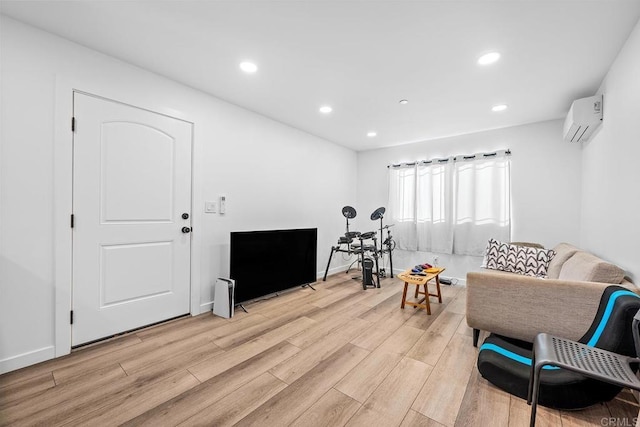 1990 Harrison Ave, San Diego, CA 92113 - living area featuring light wood finished floors, baseboards, a wall mounted AC, and recessed lighting