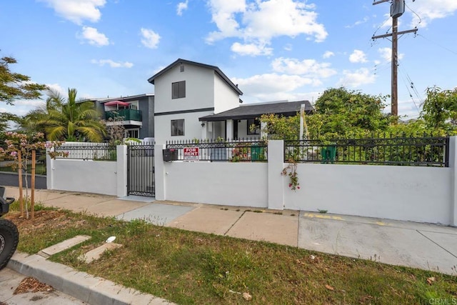 1990 Harrison Ave, San Diego, CA 92113 - exterior space featuring a fenced front yard, stucco siding, and a gate