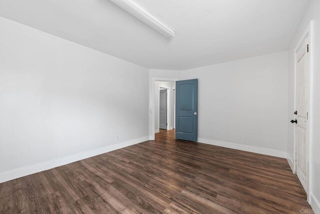 1990 Harrison Ave, San Diego, CA 92113 - unfurnished bedroom with baseboards, dark wood-style flooring, and a closet