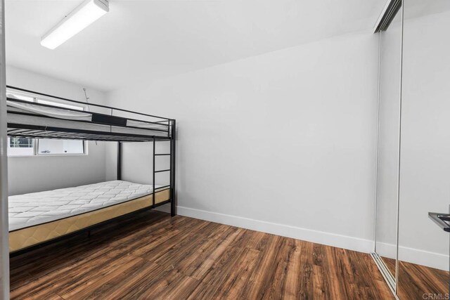 1990 Harrison Ave, San Diego, CA 92113 - unfurnished bedroom featuring a closet, wood finished floors, and baseboards