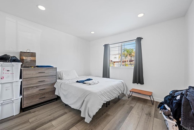 1990 Harrison Ave, San Diego, CA 92113 - bedroom with light wood-style flooring, baseboards, and recessed lighting