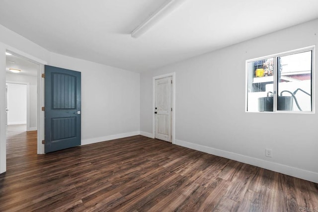 1990 Harrison Ave, San Diego, CA 92113 - empty room with dark wood-style flooring and baseboards
