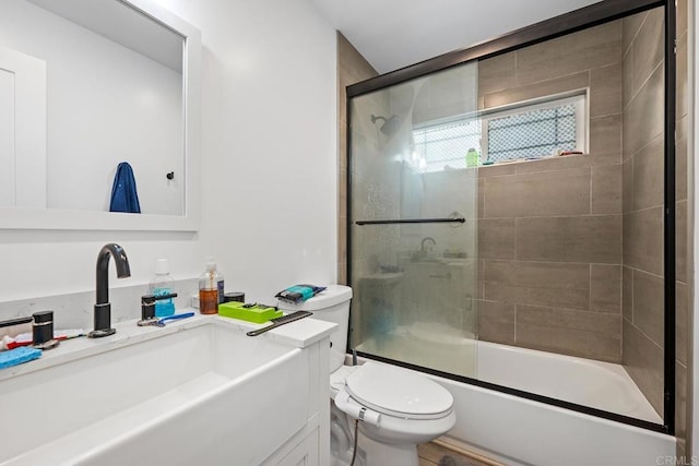 1990 Harrison Ave, San Diego, CA 92113 - bathroom with toilet, vanity, and shower / bath combination with glass door