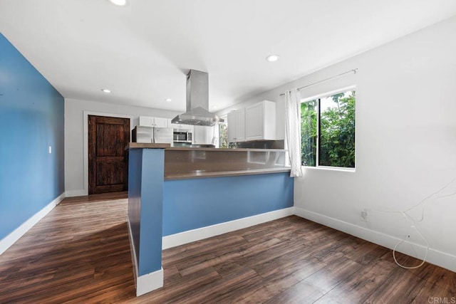 1990 Harrison Ave, San Diego, CA 92113 - kitchen with stainless steel appliances, white cabinetry, island exhaust hood, and dark wood finished floors