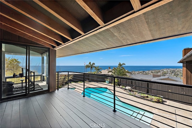 wooden deck with a water view