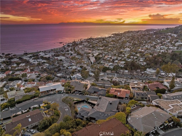 drone / aerial view featuring a water view and a residential view