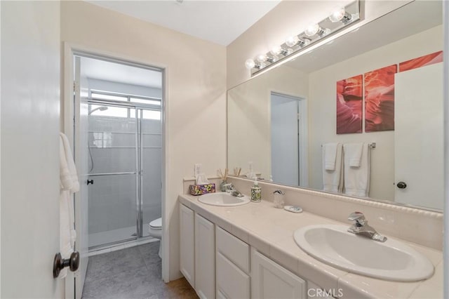 48674 Acropolis St, Indio, CA 92201 - full bathroom with toilet, double vanity, a shower stall, and tile patterned floors