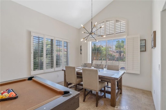 48674 Acropolis St, Indio, CA 92201 - dining room with a chandelier, plenty of natural light, and high vaulted ceiling