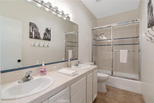 48674 Acropolis St, Indio, CA 92201 - bathroom with toilet, double vanity, shower / bath combination with glass door, and tile patterned flooring