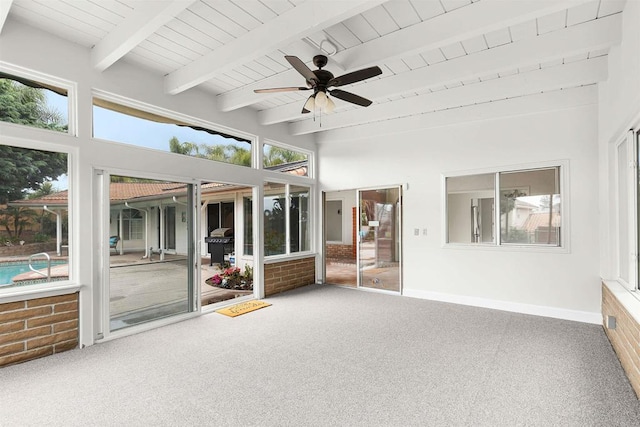 unfurnished sunroom featuring beam ceiling and ceiling fan