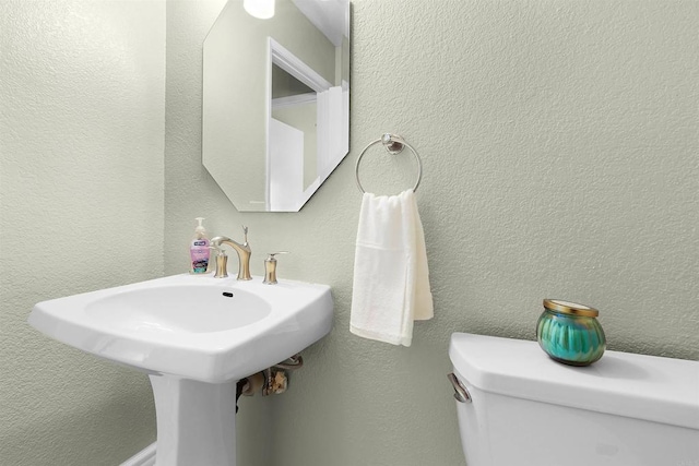bathroom featuring toilet