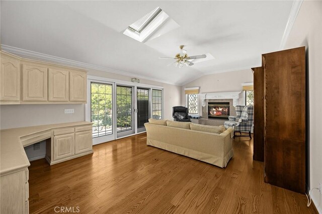 15723 La Belle St, Hacienda Heights, CA 91745 - living area with built in study area, a wealth of natural light, vaulted ceiling with skylight, and wood finished floors