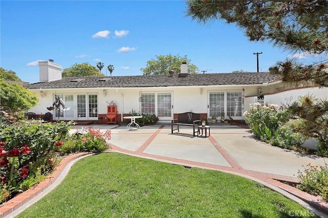 15723 La Belle St, Hacienda Heights, CA 91745 - back of house with stucco siding, a chimney, a lawn, and a patio area