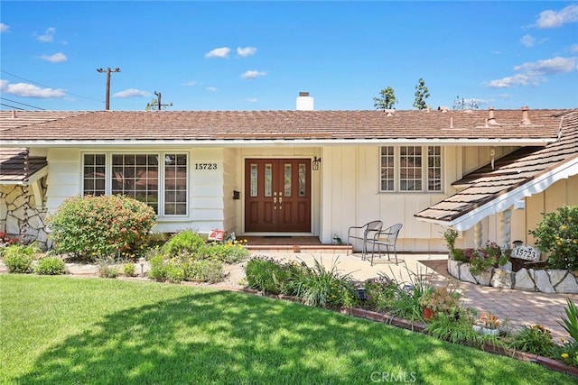 15723 La Belle St, Hacienda Heights, CA 91745 - view of front of house featuring a chimney and a front yard