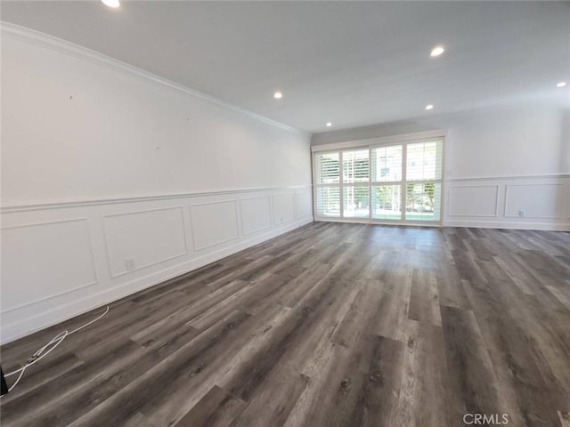 22723 Maple Ave, Torrance, CA 90505 - empty room with a decorative wall, wainscoting, ornamental molding, and dark wood-style flooring