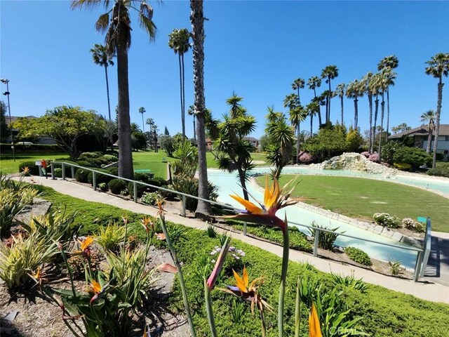 view of property's community featuring a yard