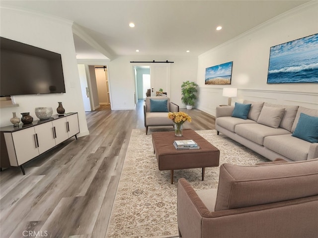 22723 Maple Ave, Torrance, CA 90505 - living room featuring a barn door, wood finished floors, crown molding, and recessed lighting