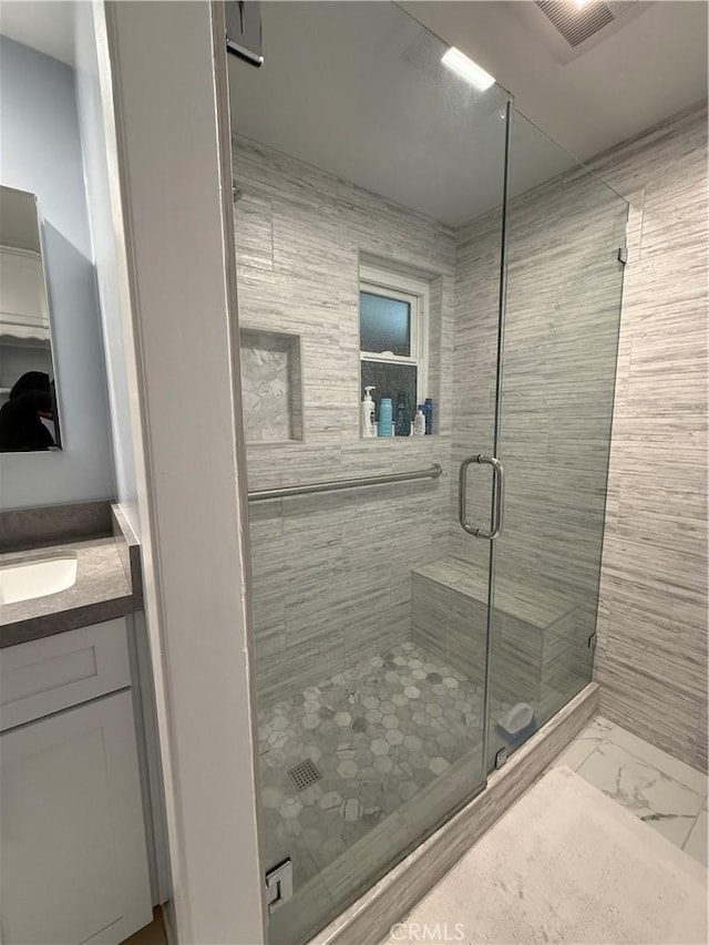 22723 Maple Ave, Torrance, CA 90505 - bathroom with a stall shower, vanity, and marble finish floors