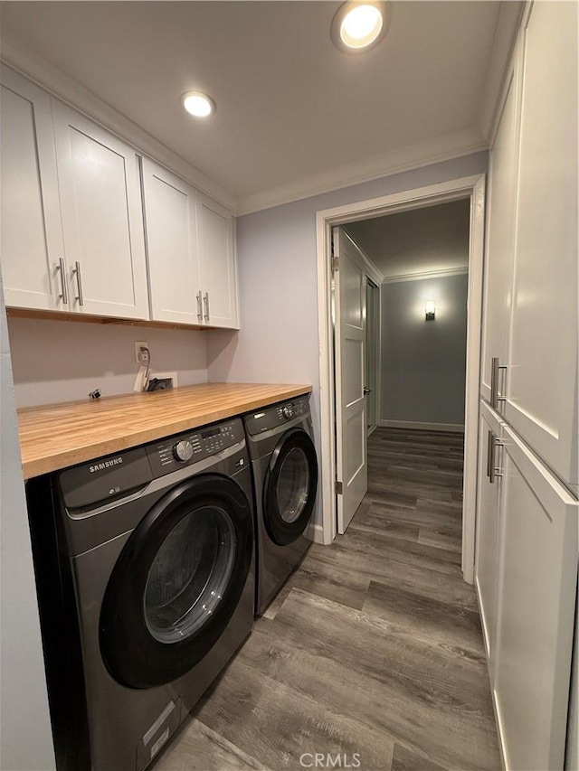 22723 Maple Ave, Torrance, CA 90505 - washroom featuring washing machine and dryer, cabinet space, dark wood-style flooring, ornamental molding, and recessed lighting