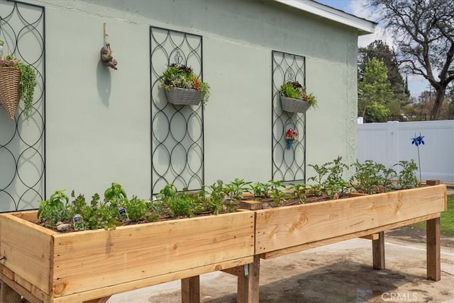 view of outbuilding featuring fence