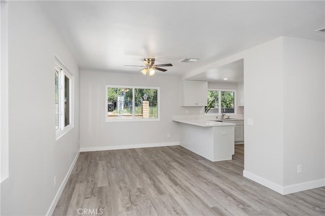 33340 Gisborne Way, Lake Elsinore, CA 92530 - unfurnished living room featuring light wood-style flooring and a ceiling fan