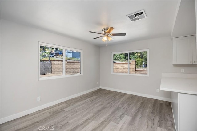33340 Gisborne Way, Lake Elsinore, CA 92530 - unfurnished dining area featuring plenty of natural light, light wood-style floors, ceiling fan, and baseboards