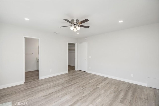 33340 Gisborne Way, Lake Elsinore, CA 92530 - unfurnished bedroom featuring recessed lighting, light wood finished floors, a spacious closet, a closet, and a ceiling fan