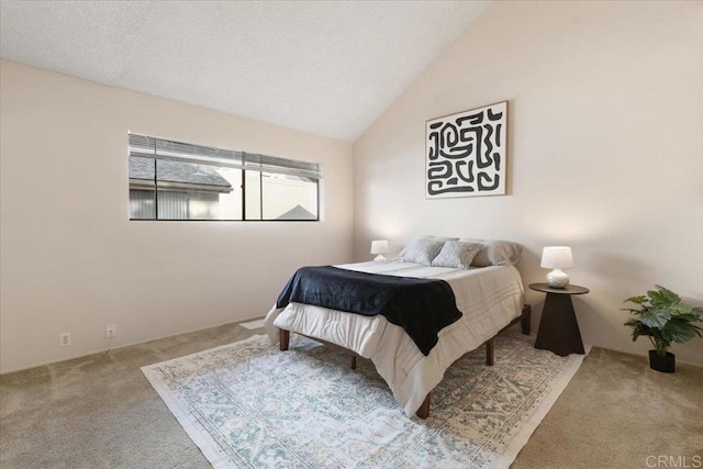 carpeted bedroom with vaulted ceiling