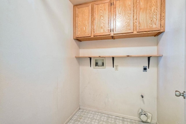 washroom with cabinet space, baseboards, hookup for an electric dryer, and hookup for a washing machine