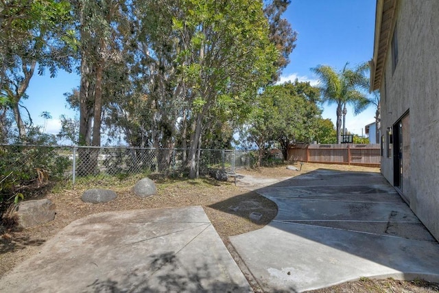 view of yard with a patio and a fenced backyard