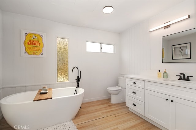 1145 Apache, Topanga, CA 90290 - bathroom with wood finished floors, a freestanding tub, vanity, toilet, and baseboards