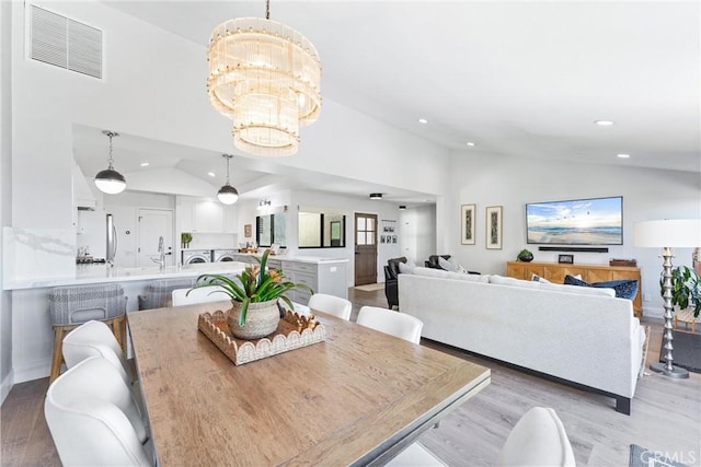 22831 Mariano Dr, Laguna Niguel, CA 92677 - dining space featuring light wood-type flooring, vaulted ceiling, visible vents, and recessed lighting