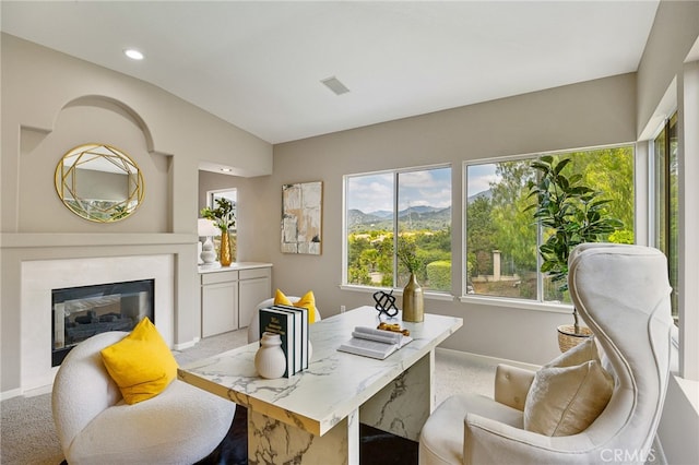 office area with a mountain view, recessed lighting, vaulted ceiling, a fireplace, and baseboards