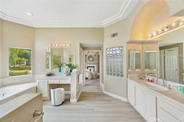 full bathroom with wood finished floors, vanity, visible vents, recessed lighting, and baseboards