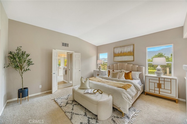 bedroom featuring carpet floors, lofted ceiling, baseboards, and visible vents