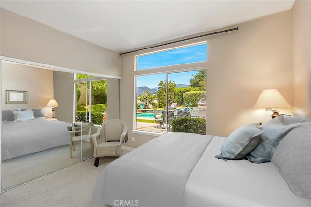 carpeted bedroom with baseboards