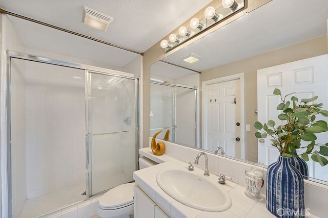 full bathroom with a shower stall, toilet, vanity, and visible vents