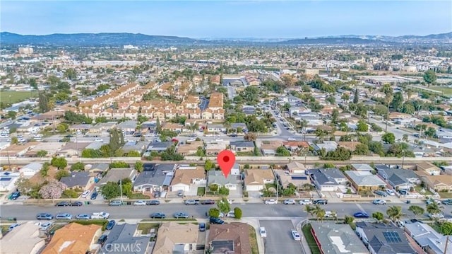 birds eye view of property with a residential view and a mountain view