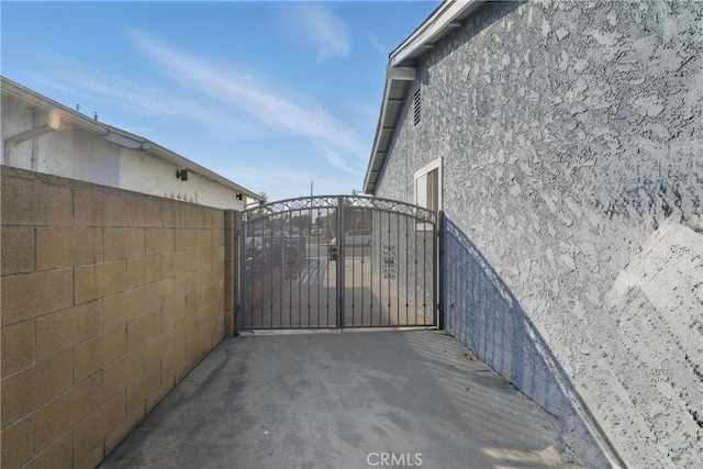 view of gate featuring fence