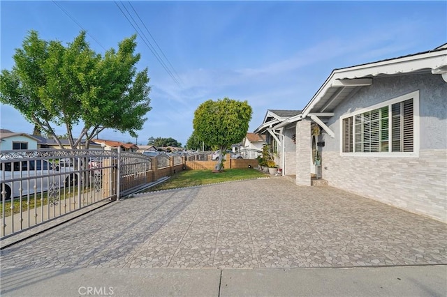 exterior space with driveway and fence